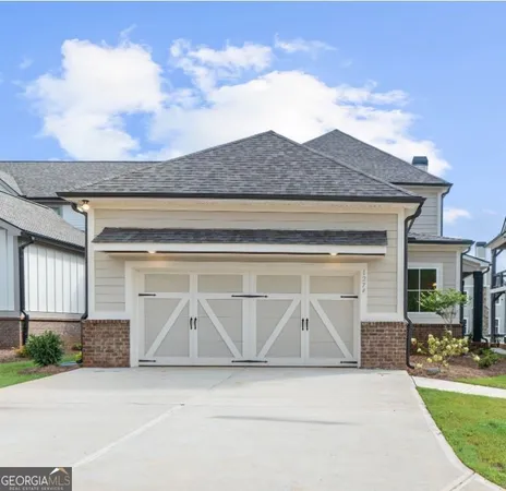 a view of house and garage