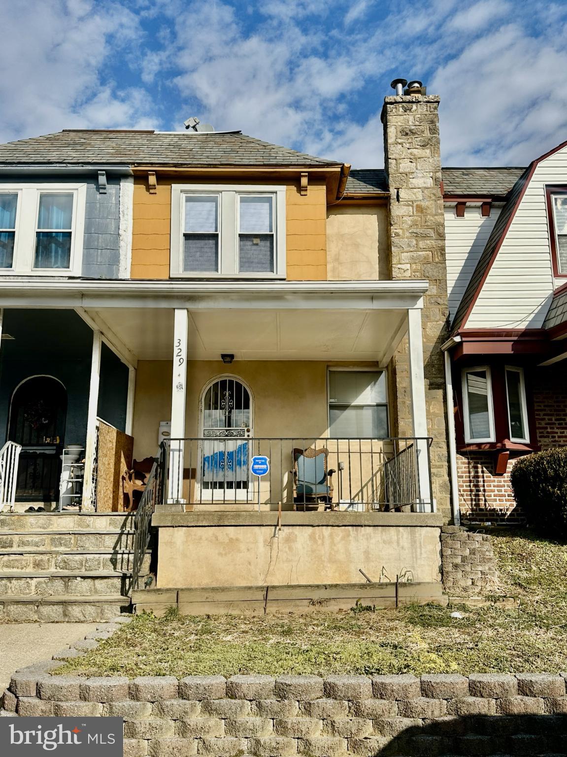 a view of a building with a backyard