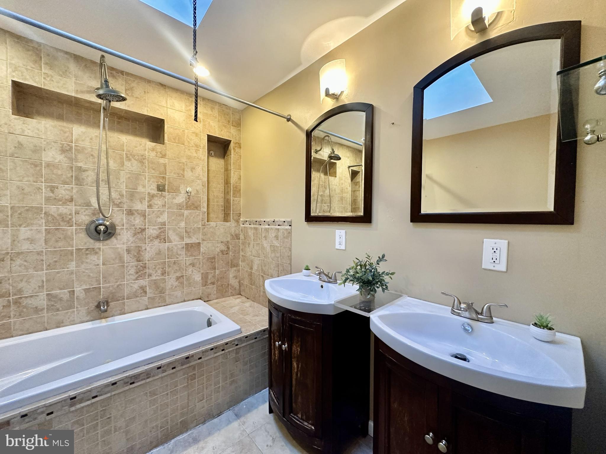 329 Sanford Road Upper Darby, PA 19082 - Photo 14 of 19 a bathroom with a double vanity sink mirror and bathtub