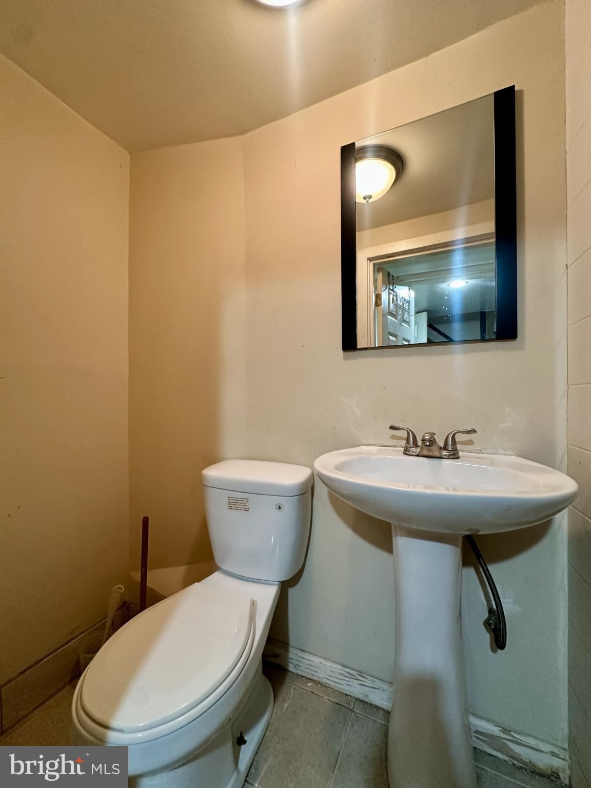 329 Sanford Road Upper Darby, PA 19082 - Photo 18 of 19 a bathroom with a toilet a sink and mirror