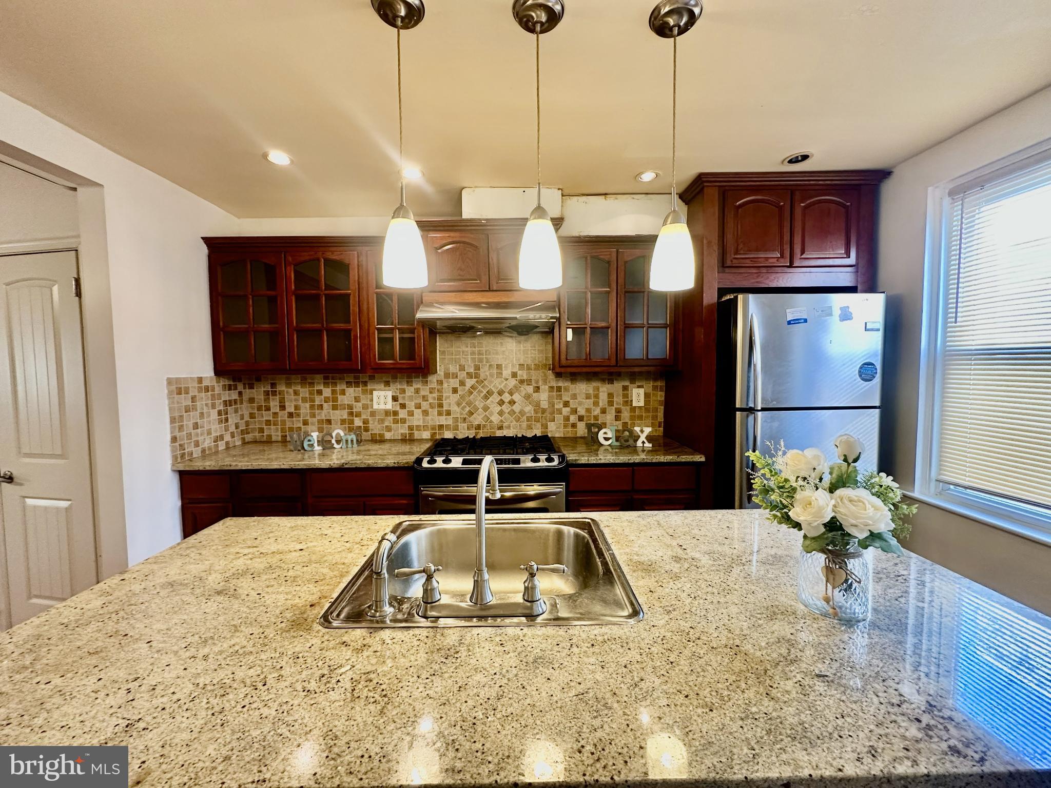 329 Sanford Road Upper Darby, PA 19082 - Photo 7 of 19 a kitchen that has a lot of cabinets in it