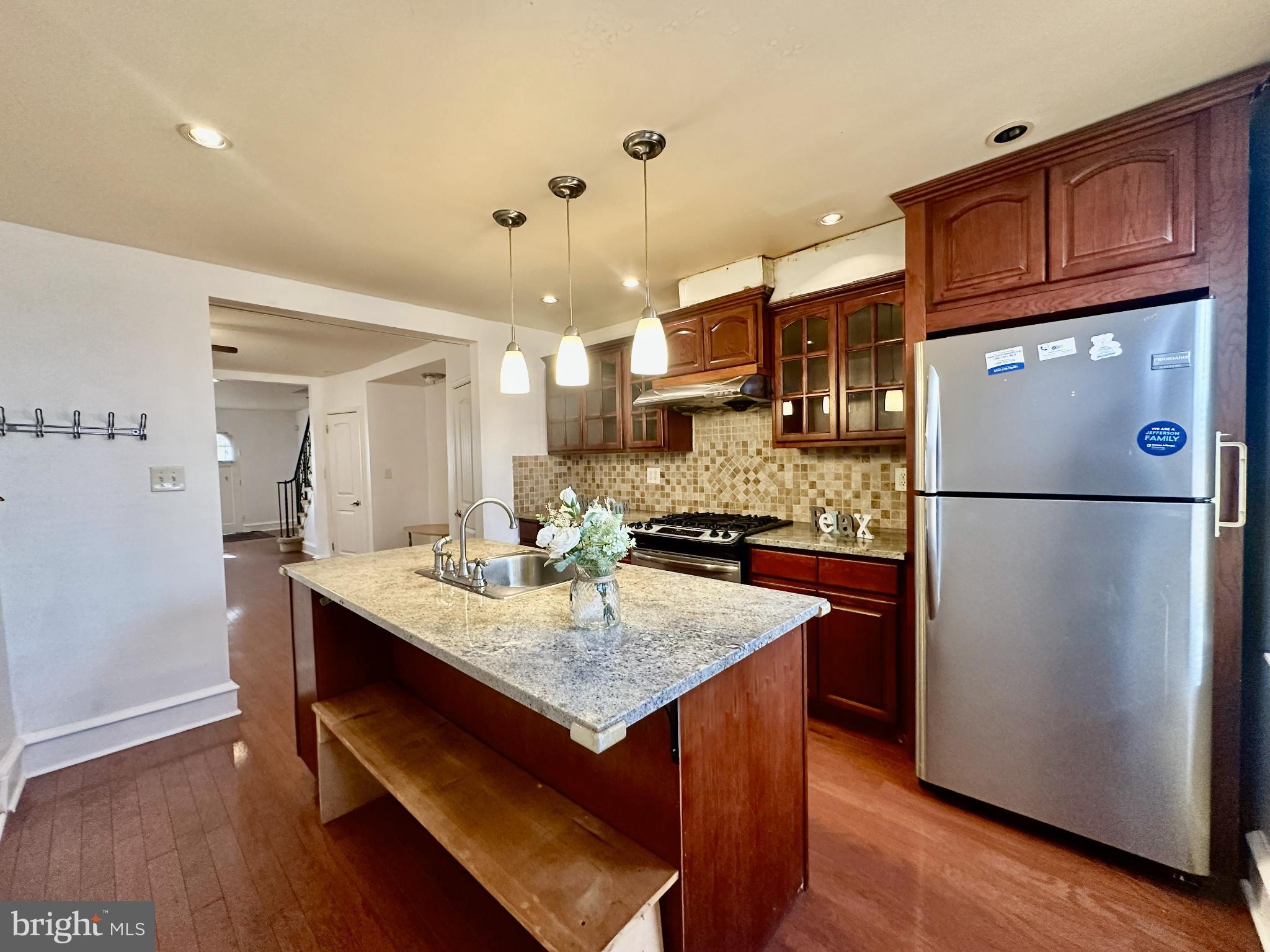 329 Sanford Road Upper Darby, PA 19082 - Photo 8 of 19 a kitchen with refrigerator and cabinets