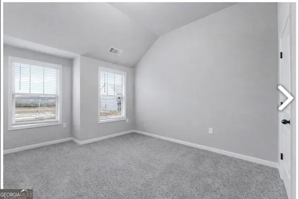 a view of an empty room with window