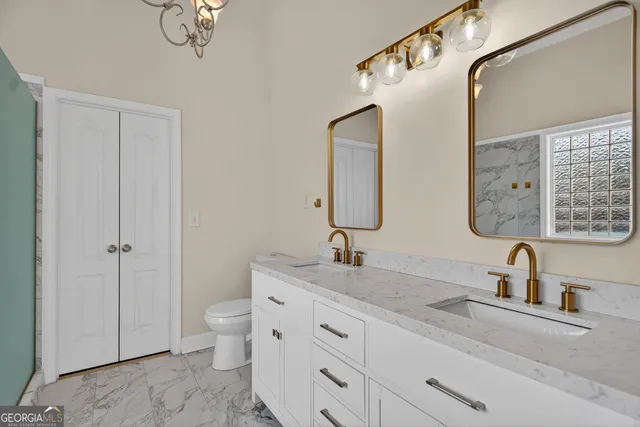 a bathroom with a double vanity sink and a mirror