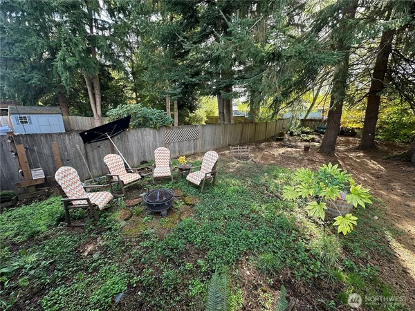 a view of a backyard with sitting area