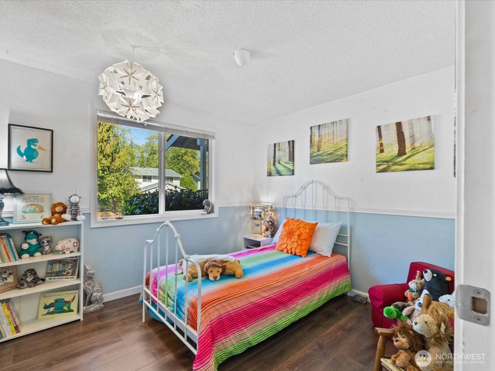 900 116th Street Southwest Everett, WA 98204 - Photo 22 of 40 a bedroom with a bed and a wooden floor