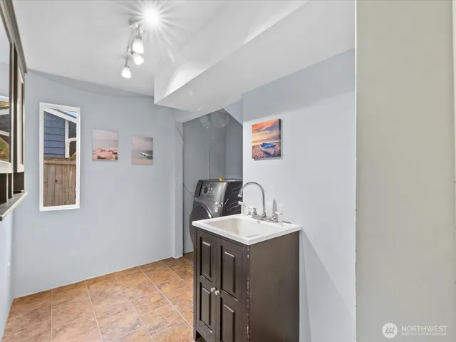 a bathroom with a sink vanity and a mirror
