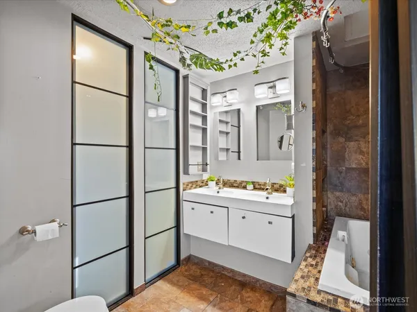 a bathroom with a sink and mirror