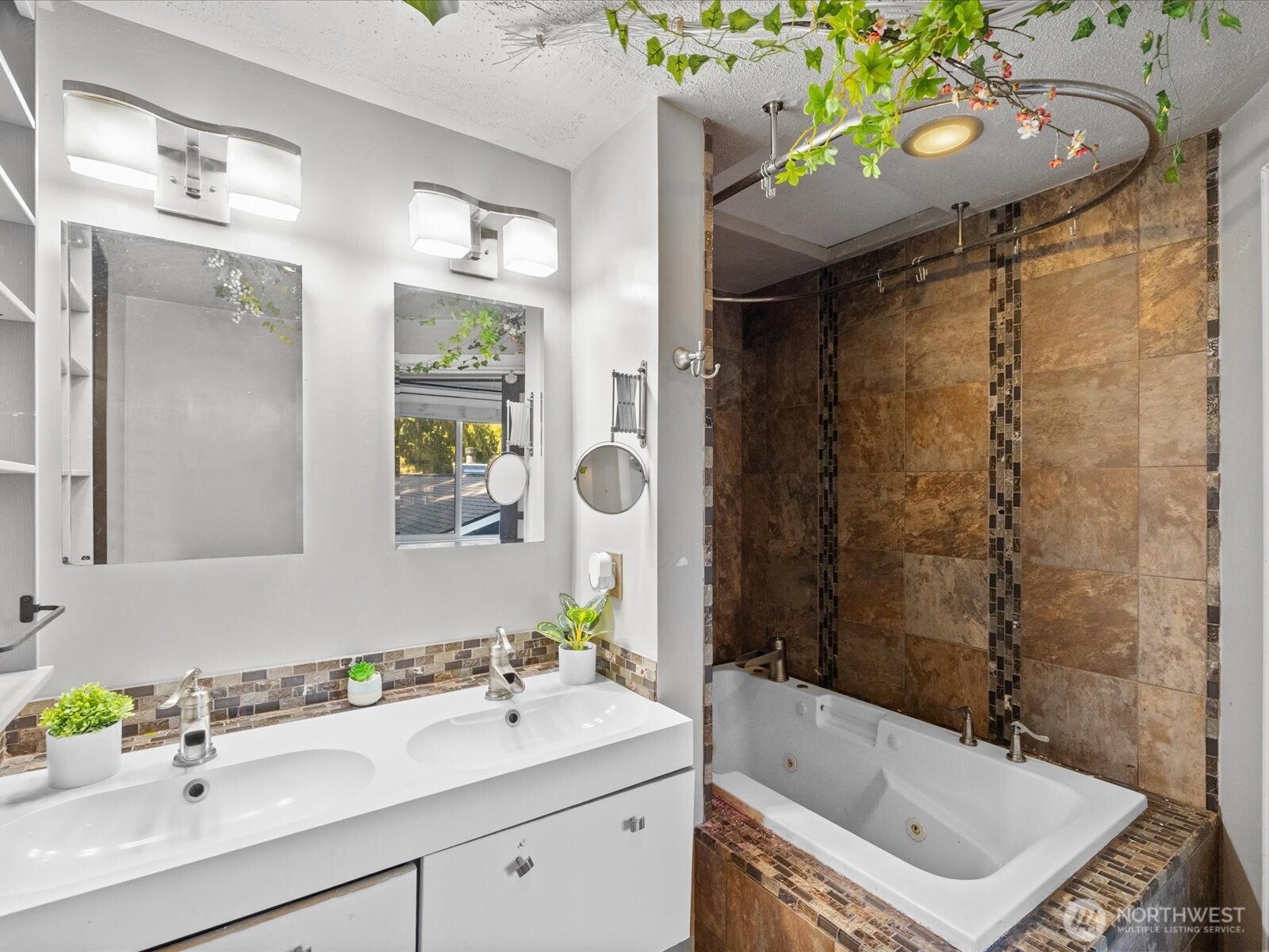 900 116th Street Southwest Everett, WA 98204 - Photo 28 of 40 a bathroom with a sink mirror vanity and bathtub