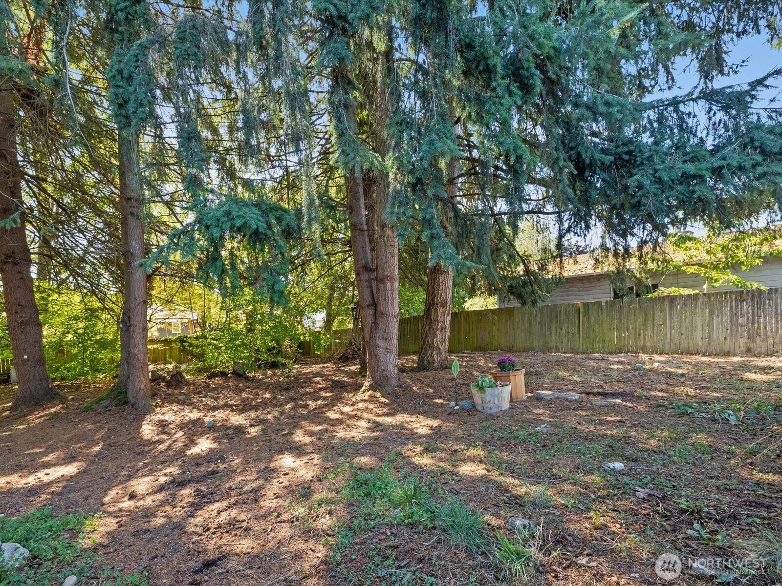 900 116th Street Southwest Everett, WA 98204 - Photo 33 of 40 a backyard of a house with lots of green space and fountain