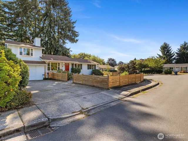 a view of house with outdoor space and sitting area