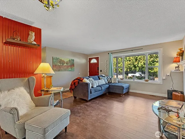 a bedroom with furniture and a window