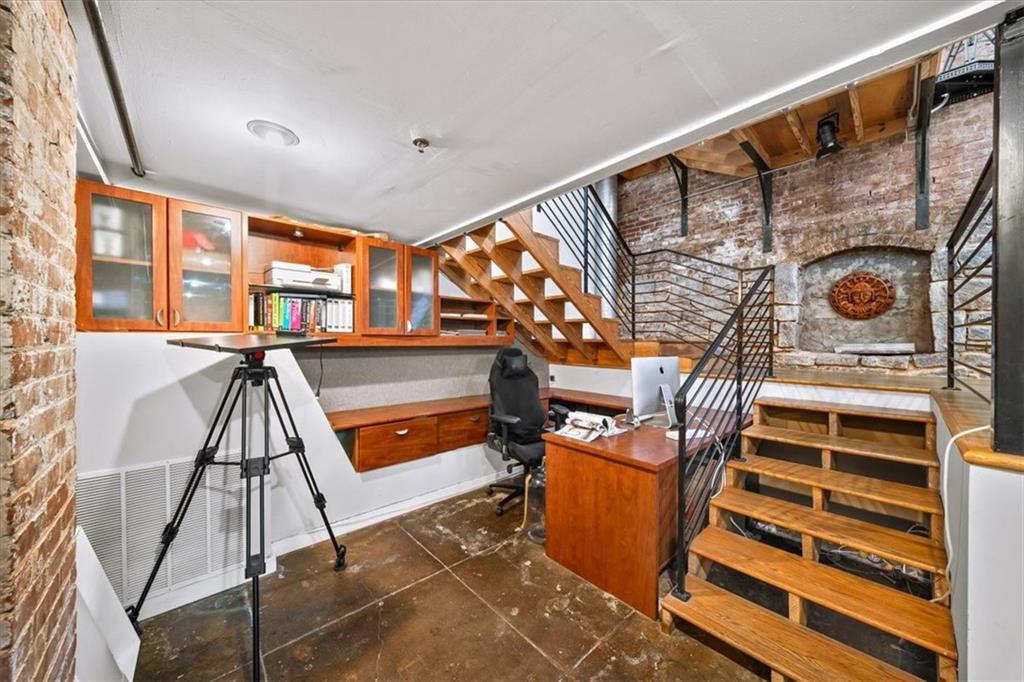 330 Peters Street Southwest, Unit 105 Atlanta, GA 30313 - Photo 17 of 27 a view of staircase with a rug and a window