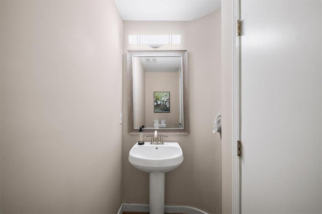 330 Peters Street Southwest, Unit 105 Atlanta, GA 30313 - Photo 9 of 27 a bathroom with a sink and a mirror
