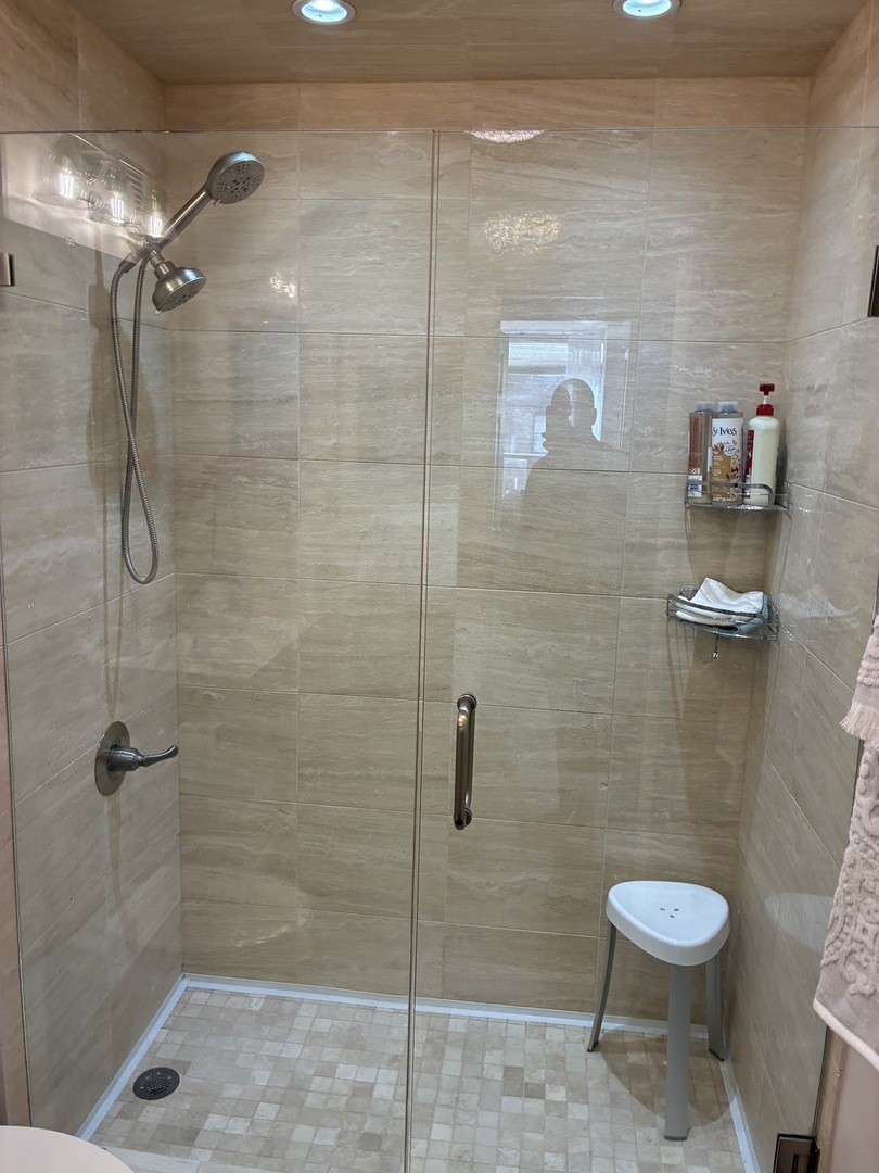 110 East Delaware Place, Unit 2003 Chicago, IL 60611 - Photo 11 of 13 a bathroom with a toilet and a shower