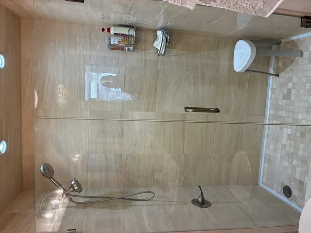 a bathroom with a sink vanity and a mirror