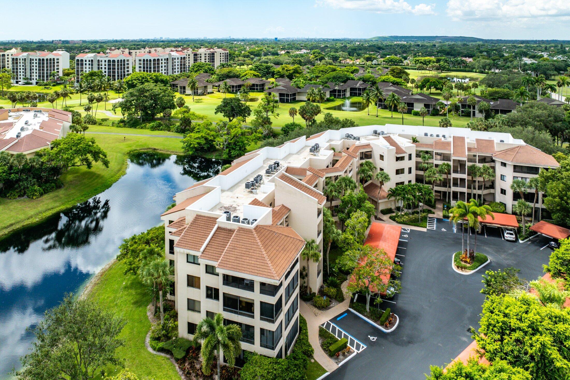 7546 La Paz Boulevard, Unit 404 Boca Raton, FL 33433 - Photo 29 of 47 an aerial view of a house with a garden