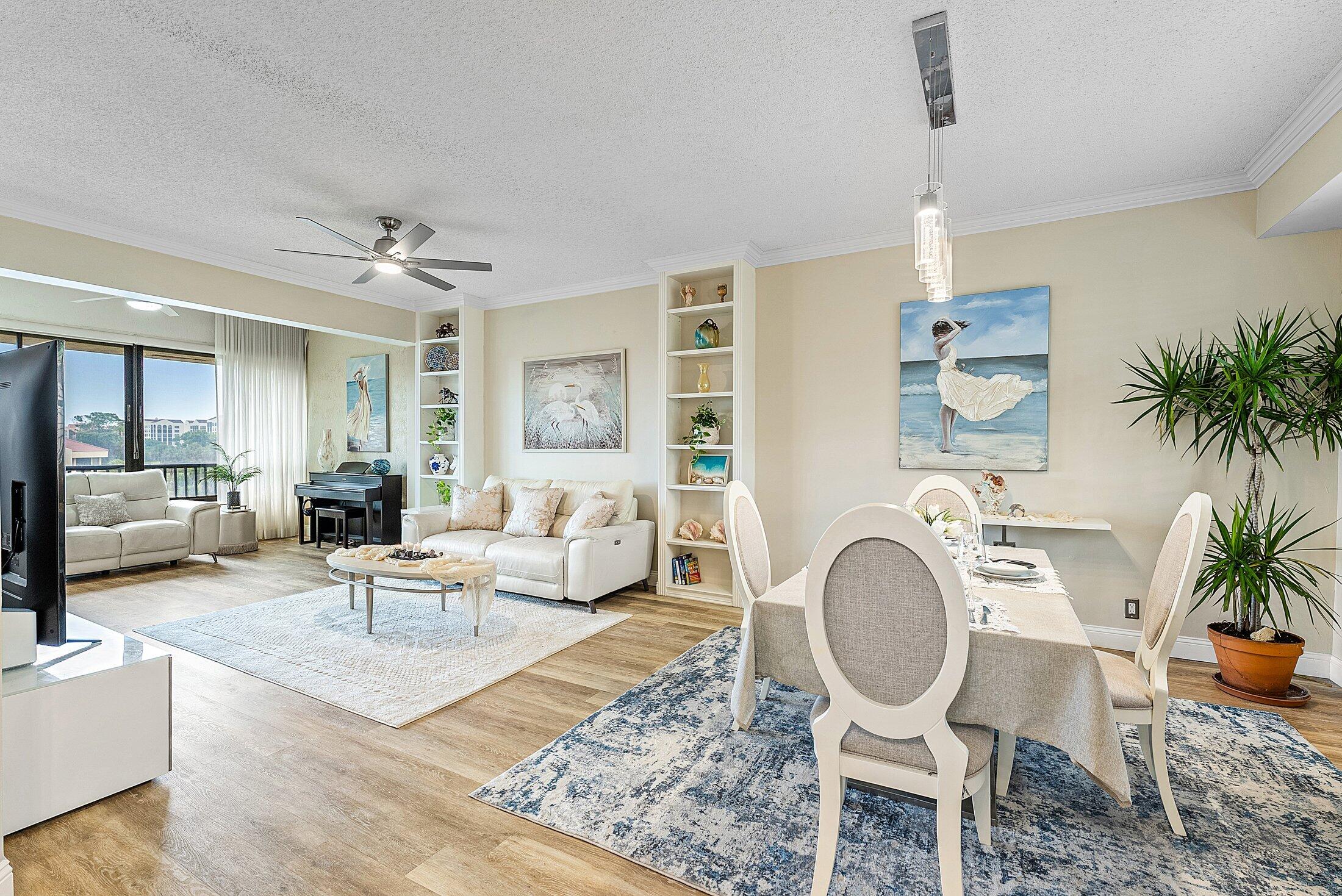 7546 La Paz Boulevard, Unit 404 Boca Raton, FL 33433 - Photo 4 of 47 a living room with furniture and a wooden floor