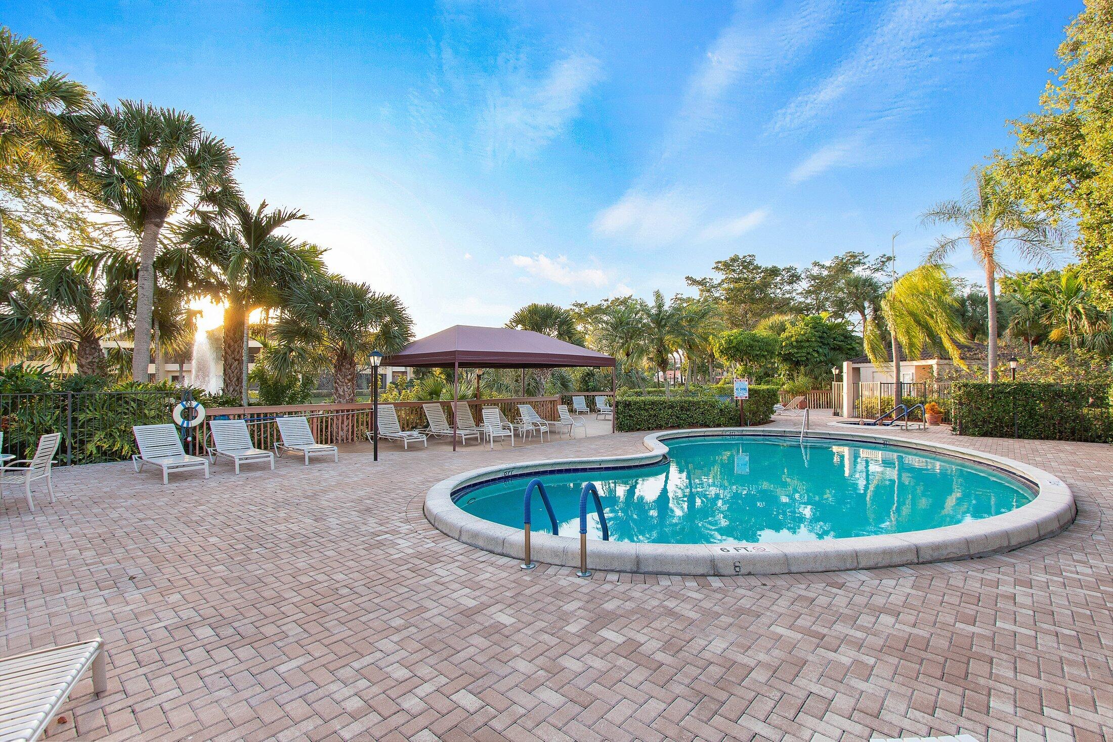 7546 La Paz Boulevard, Unit 404 Boca Raton, FL 33433 - Photo 45 of 47 a view of swimming pool with a patio