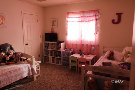 824 Walker Lane Ridgecrest, CA 93555 - Photo 15 of 20 a bed room with a bed and a window