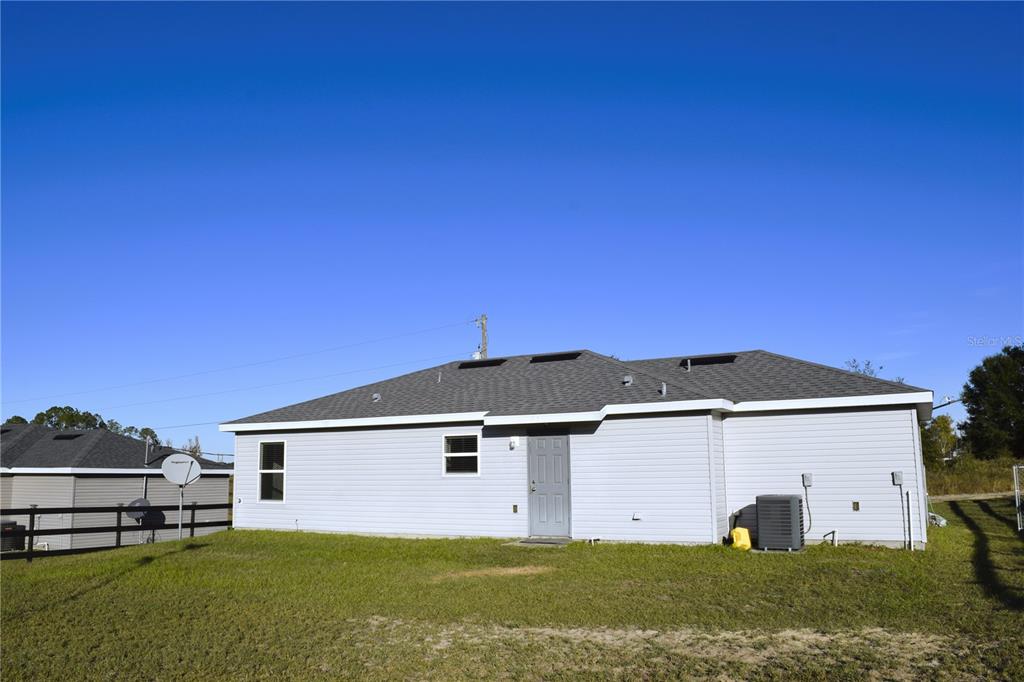 3184 Southwest 151st Avenue Ocala, FL 34481 - Photo 17 of 17 a view of a house with a yard