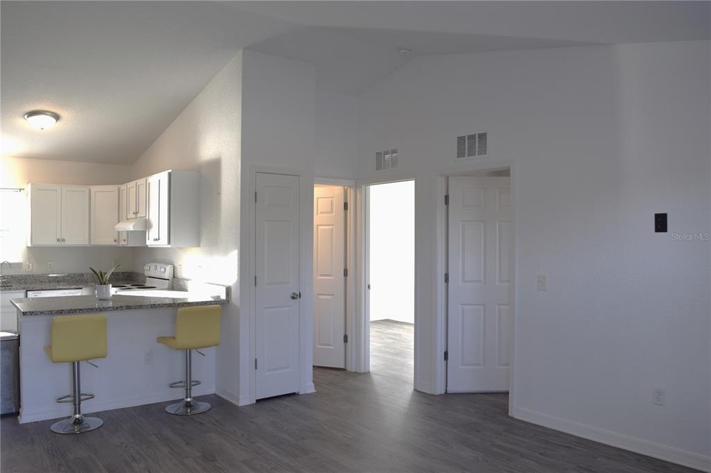3184 Southwest 151st Avenue Ocala, FL 34481 - Photo 6 of 17 a view of a kitchen with wooden floor and a sink