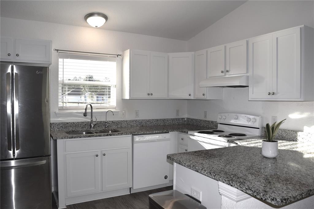 3184 Southwest 151st Avenue Ocala, FL 34481 - Photo 8 of 17 a kitchen with a sink a refrigerator and window