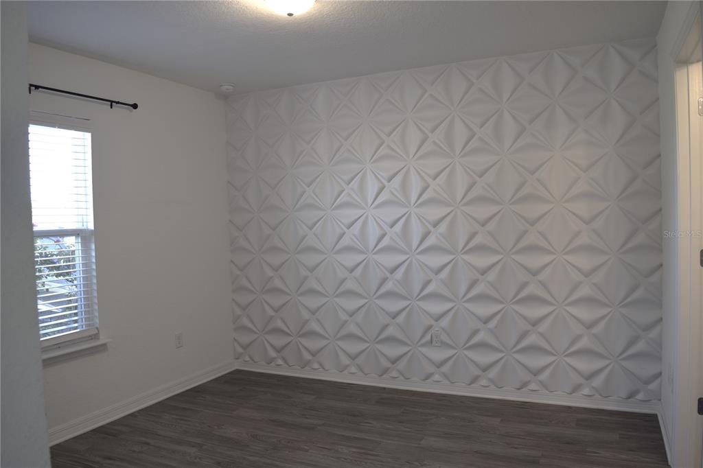 3184 Southwest 151st Avenue Ocala, FL 34481 - Photo 10 of 17 a view of an empty room and wooden floor in a room