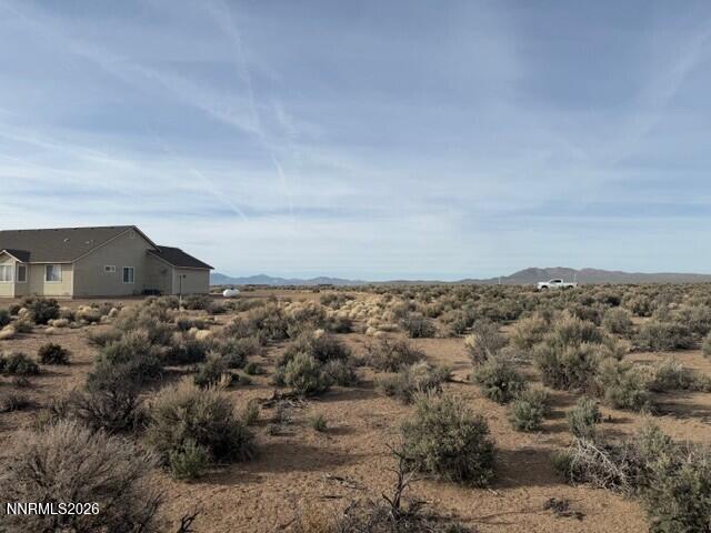 370 Ludwig Lane Smith Valley, NV 89430 - Photo 12 of 18 a view of a dry yard with wooden fence
