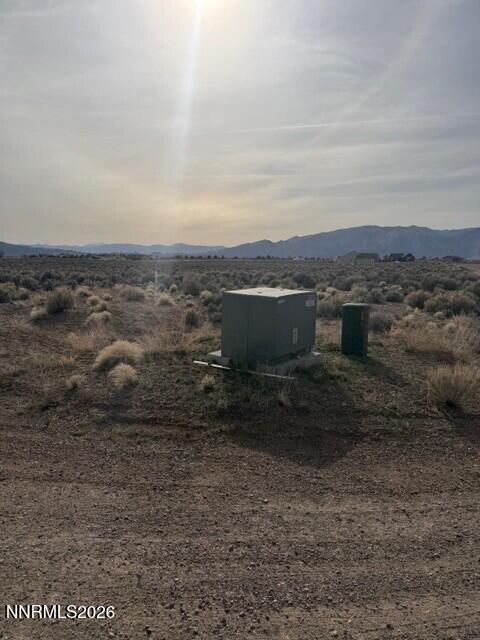 370 Ludwig Lane Smith Valley, NV 89430 - Photo 3 of 18 a view of a dry yard with trees
