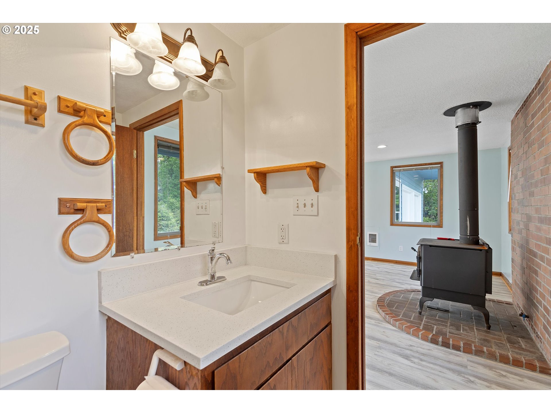 5825 Roma Avenue Cloverdale, OR 97112 - Photo 11 of 44 a bathroom with a sink a mirror and a toilet