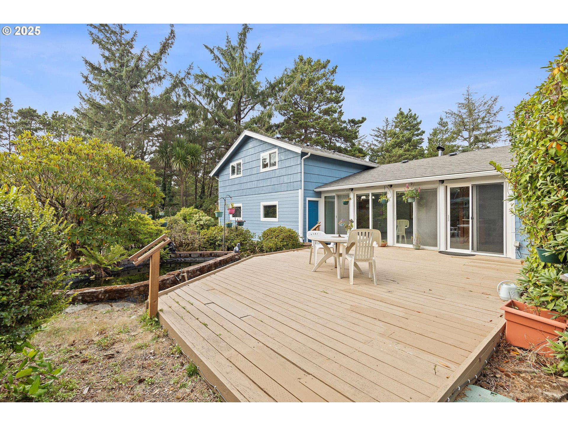 5825 Roma Avenue Cloverdale, OR 97112 - Photo 2 of 44 a house view with a seating space and garden