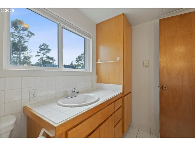 a bathroom with a sink vanity and a mirror