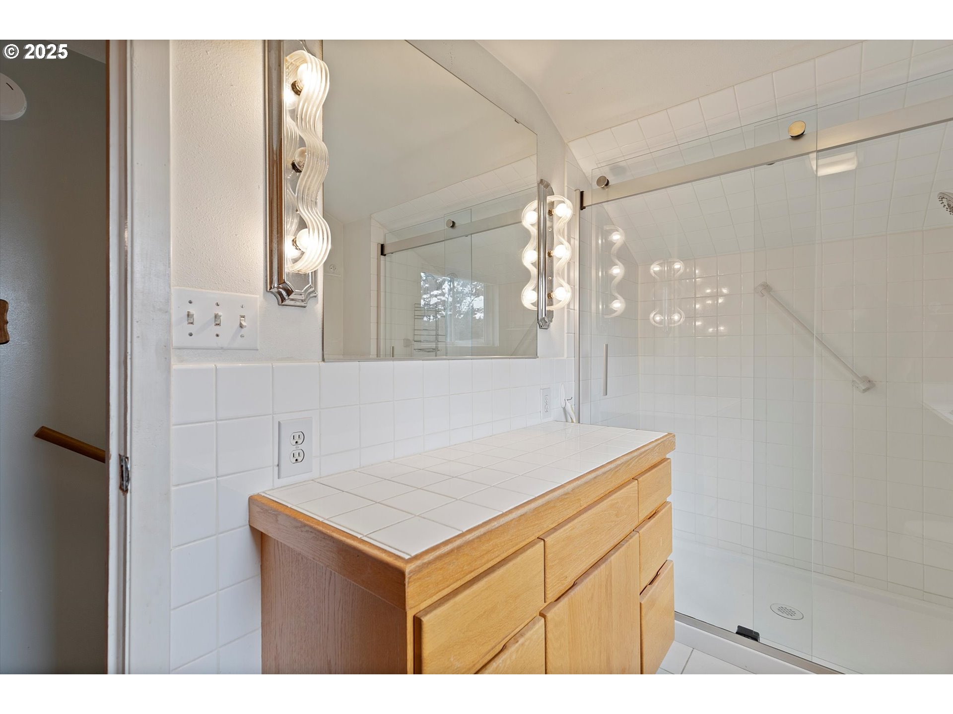 5825 Roma Avenue Cloverdale, OR 97112 - Photo 22 of 44 a bathroom with a sink vanity and a mirror