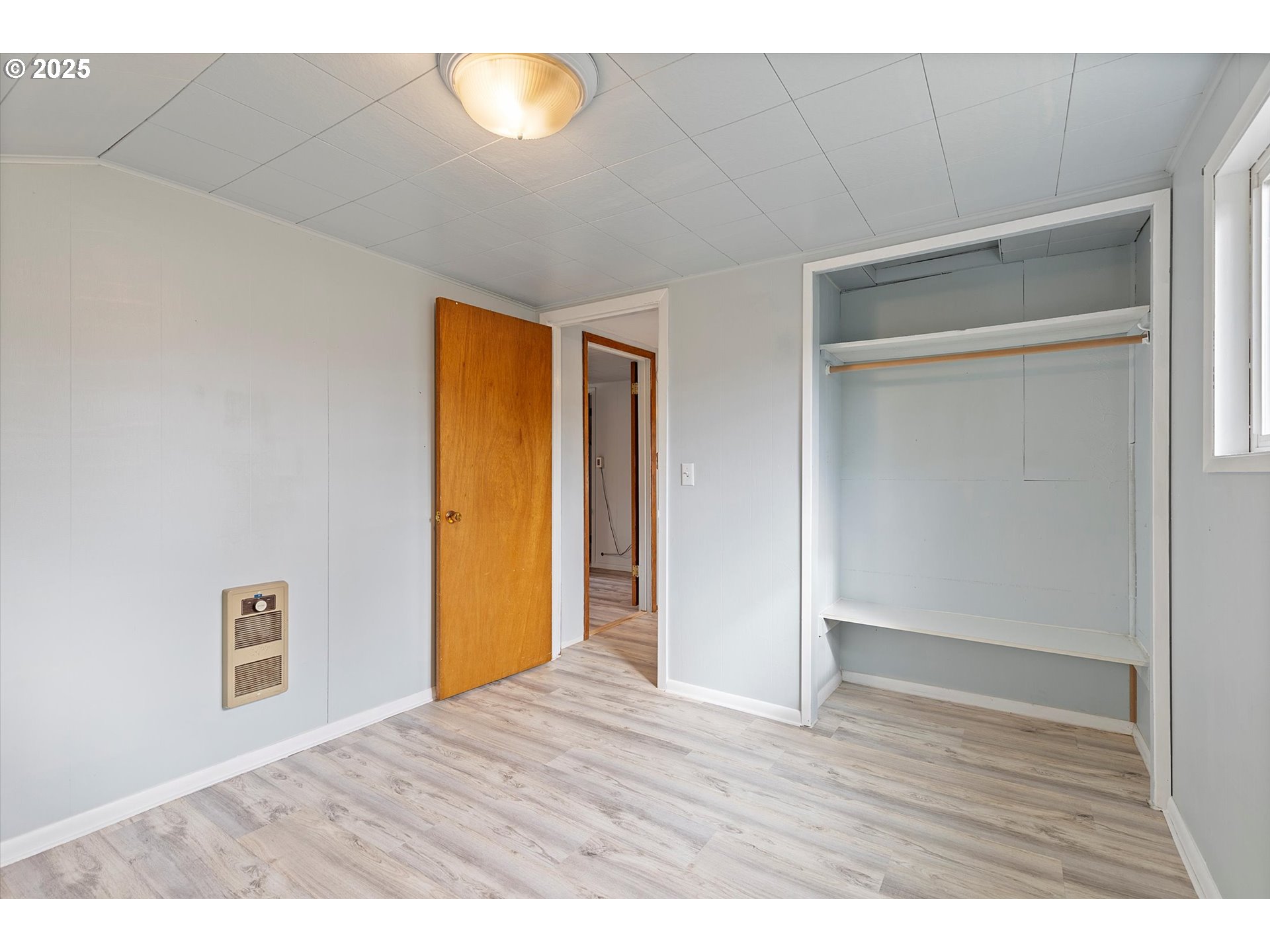 5825 Roma Avenue Cloverdale, OR 97112 - Photo 24 of 44 a view of an empty room with wooden floor