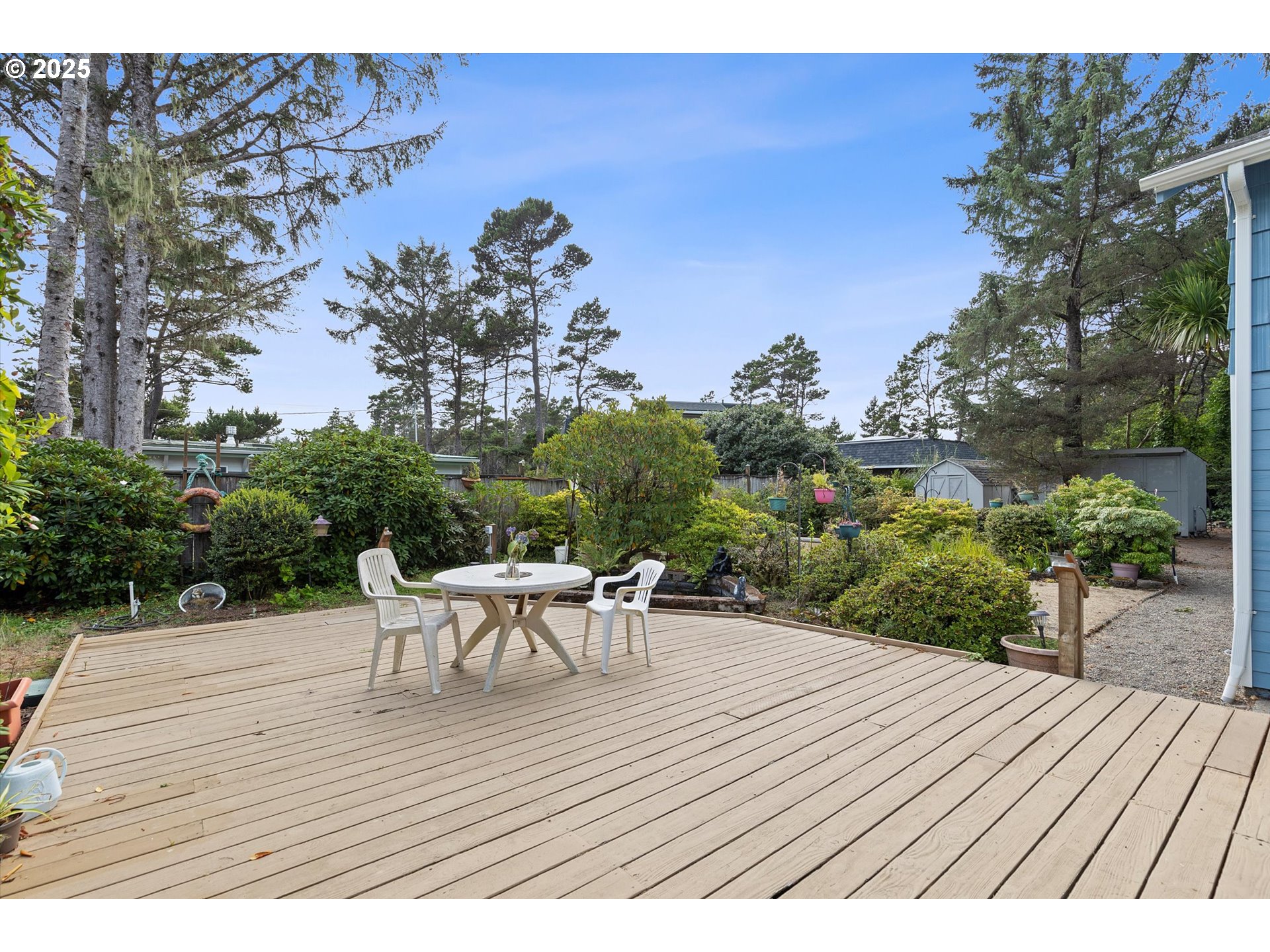 5825 Roma Avenue Cloverdale, OR 97112 - Photo 29 of 44 a view of a roof deck with table and chairs couches with wooden floor