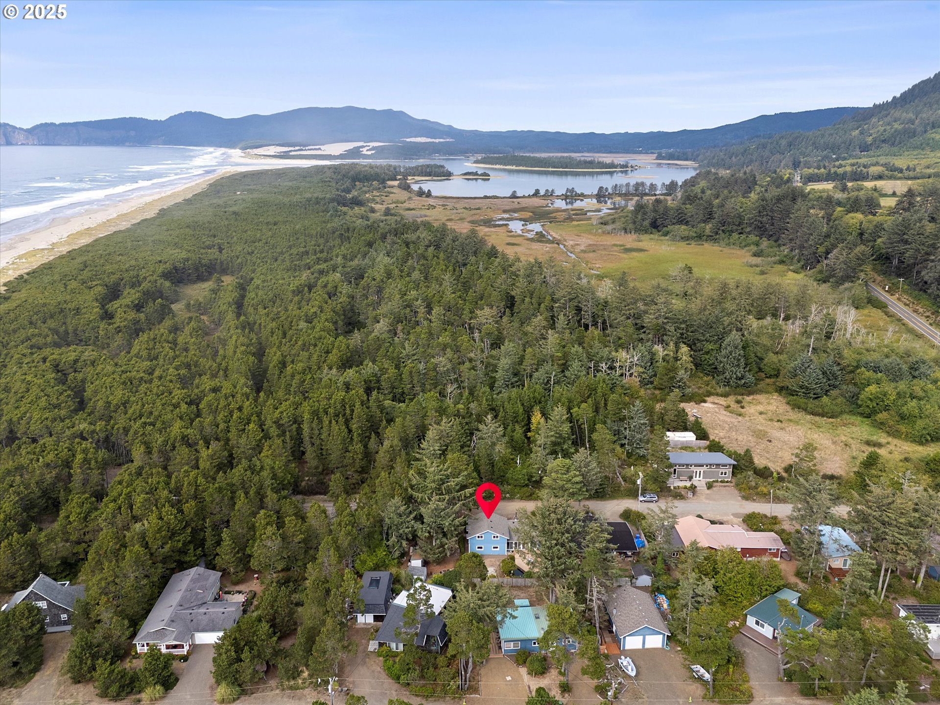 5825 Roma Avenue Cloverdale, OR 97112 - Photo 3 of 44 a view of a city with a mountain
