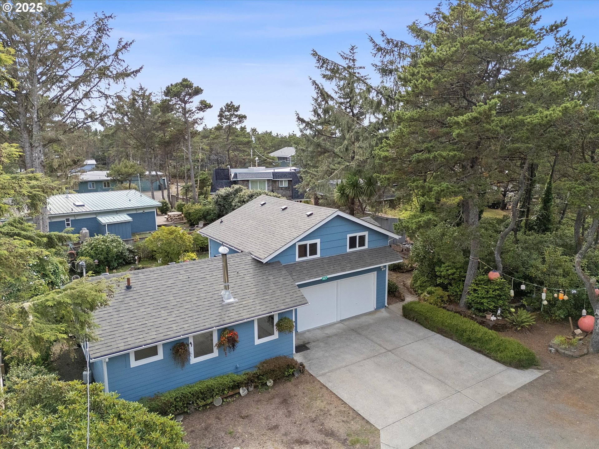 5825 Roma Avenue Cloverdale, OR 97112 - Photo 36 of 44 an aerial view of a house with a yard