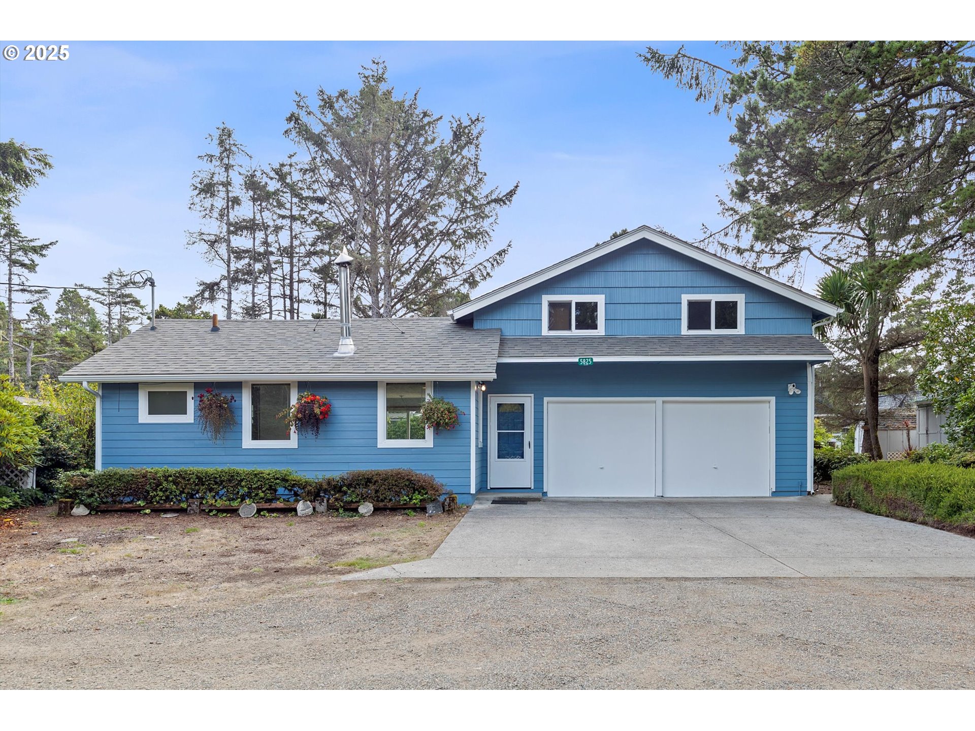 5825 Roma Avenue Cloverdale, OR 97112 - Photo 38 of 44 a front view of a house with a yard and garage