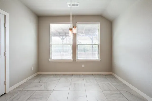 a view of a room that has a window