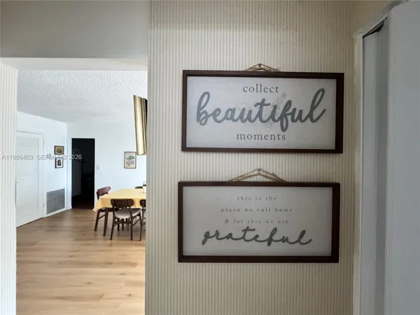 a view of dining room and wooden floor