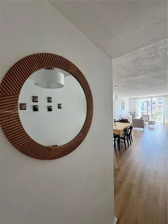 a view of livingroom and dining room with wooden floor