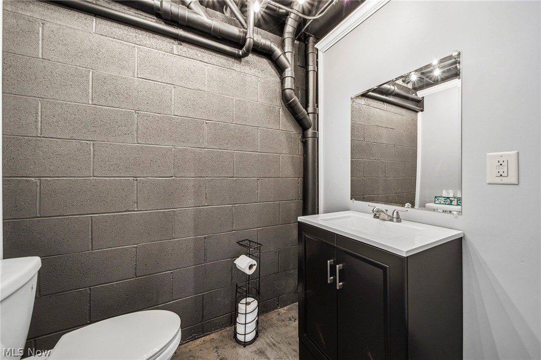 2850 South Ridge Road Perry, OH 44081 - Photo 24 of 41 Half bath featuring vanity and concrete floors