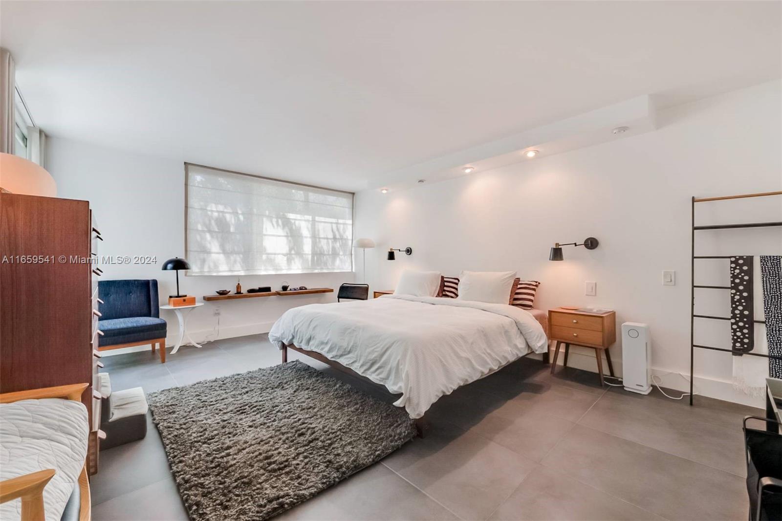 3266 Virginia Street, Unit B3 Miami, FL 33133 - Photo 12 of 24 a spacious bedroom with a bed a couch and dresser