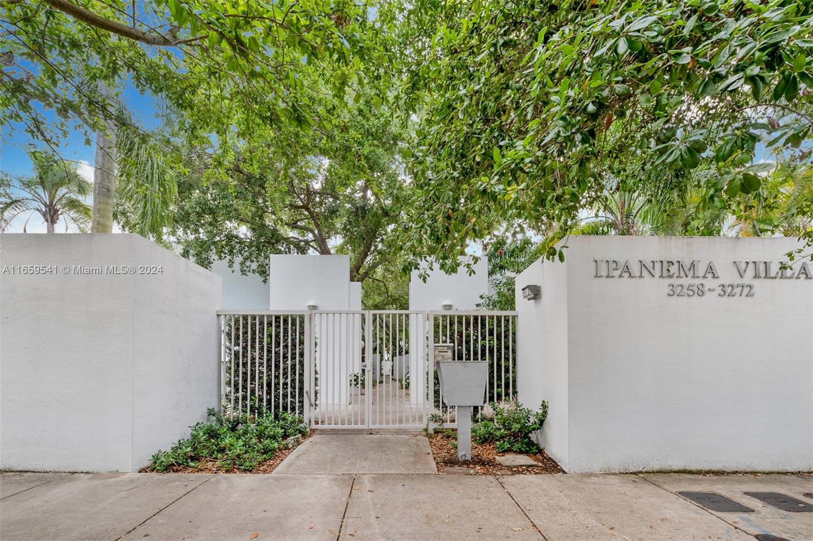 3266 Virginia Street, Unit B3 Miami, FL 33133 - Photo 3 of 24 a sign on the side of a building