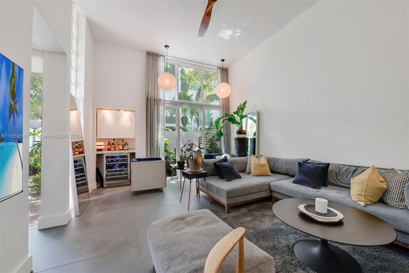 3266 Virginia Street, Unit B3 Miami, FL 33133 - Photo 5 of 24 a living room with furniture and a large window