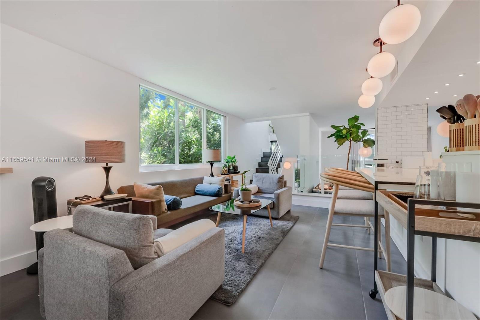 3266 Virginia Street, Unit B3 Miami, FL 33133 - Photo 7 of 24 a living room with furniture and a large window