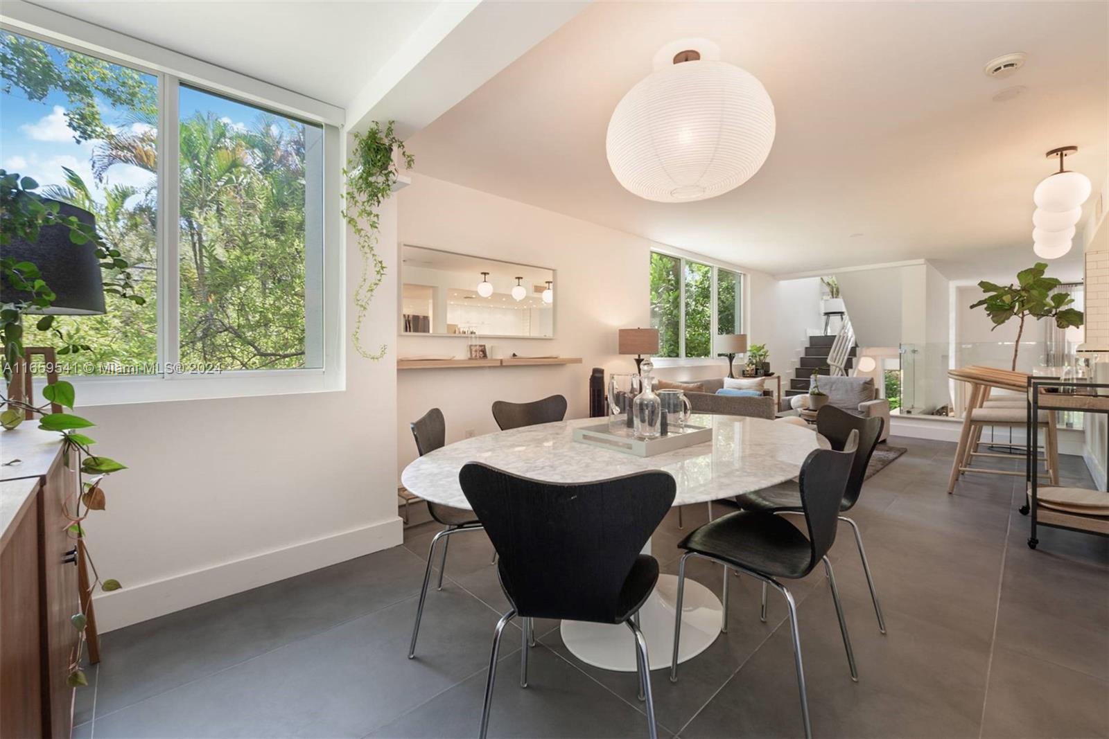 3266 Virginia Street, Unit B3 Miami, FL 33133 - Photo 10 of 24 a view of a dining room with furniture window and outside view