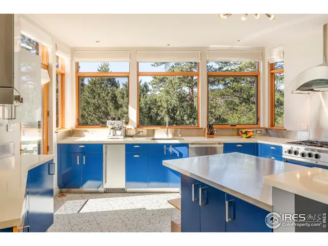 a kitchen with a window a sink and a counter