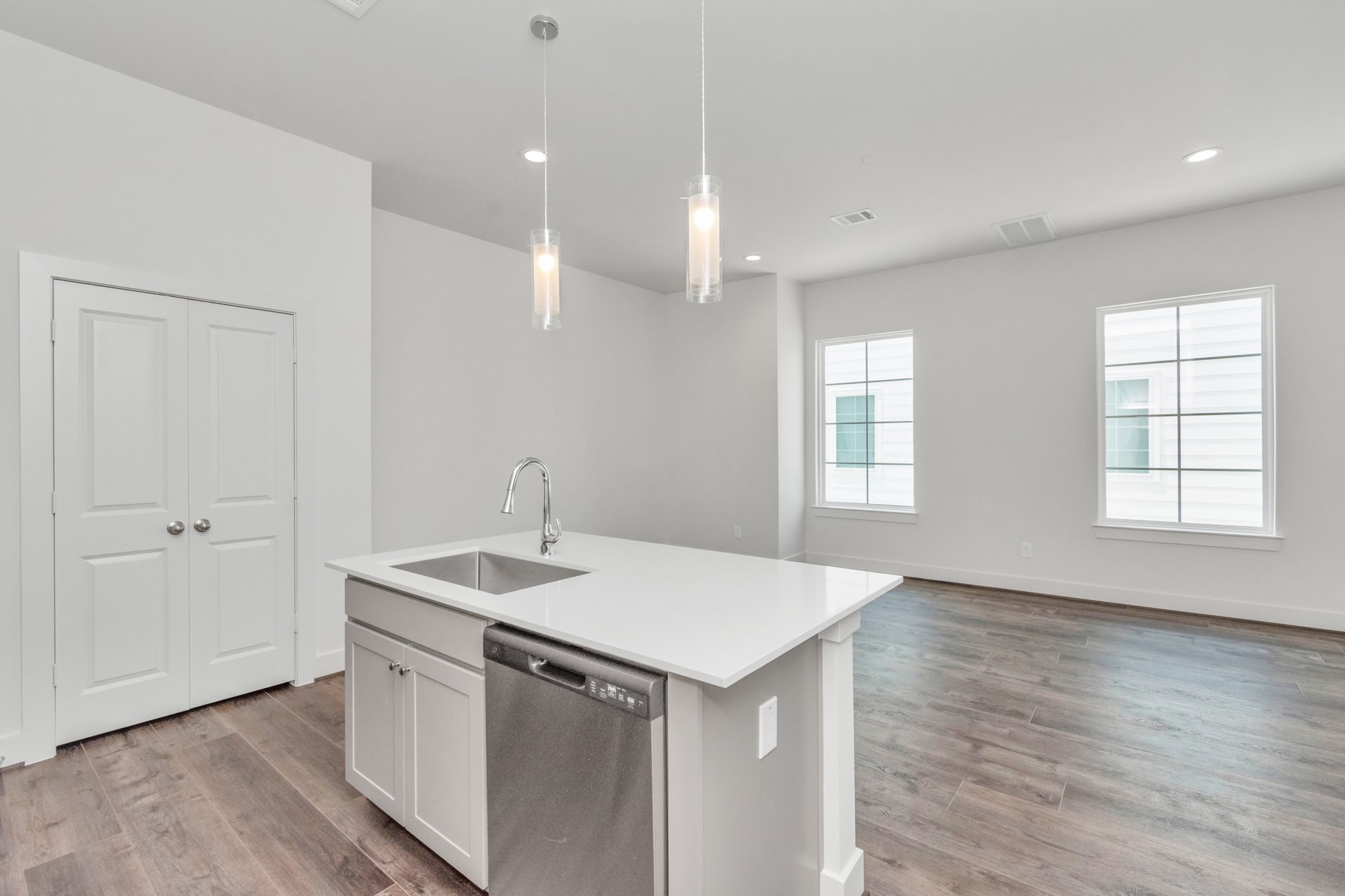 2011 East Bauer Drive Houston, TX 77080 - Photo 16 of 32 a kitchen with a sink chandelier and wooden floor